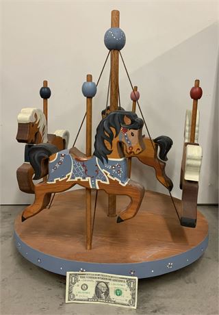 ANTIQUE WOODEN CAROUSEL THAT MOVES WITH STRING