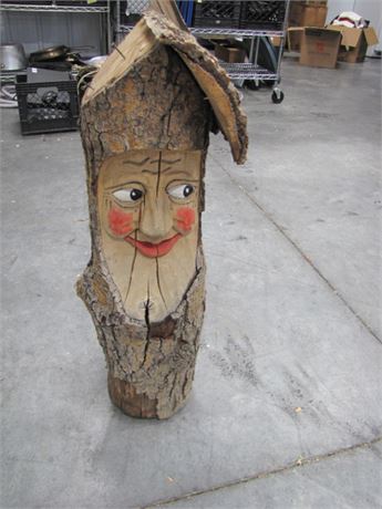 Log Carved Happy Face-1/2 Roof Missing (711 Blackhawk St. Billings)
