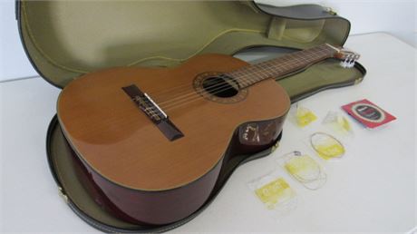 Guitar w/ Case & Extra Strings