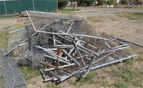 Pile of Chain Link Fence Parts Including At Least Two 10' Panels