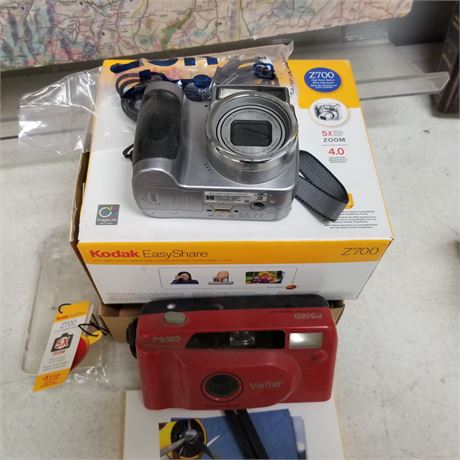 2 Cameras (1 new, 1 w/ Box)