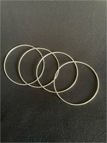 Four Silver Bangle Bracelets