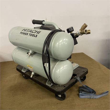 Hitachi 2-HP 4-Gallon Contractor Twin Stack Air Compressor mounted on roller