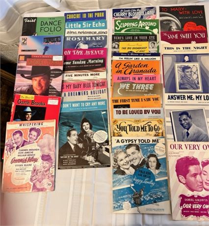 assorted music books and vintage sheet music