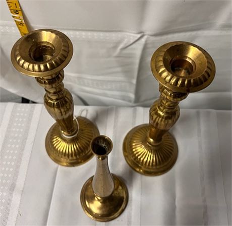 brass candlesticks and a bud vase