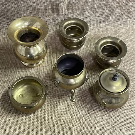 Half a Dozen Small Brass Pots