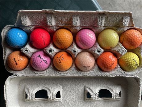 One dozen colored golf balls