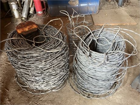 Roll of Barbed Wire and Partial Roll of Barbless Wire