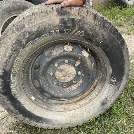 USED TIRE AND 8 HOLE WHEEL