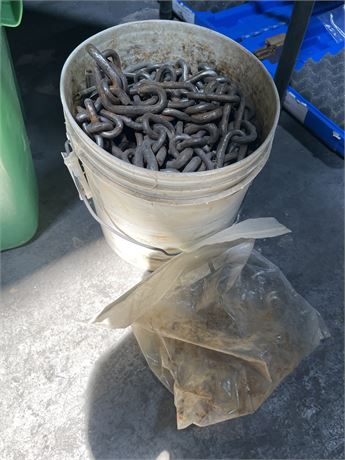 Bucket of chains and fasteners