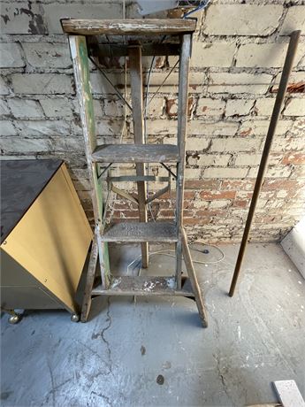 Three legged wooden ladder