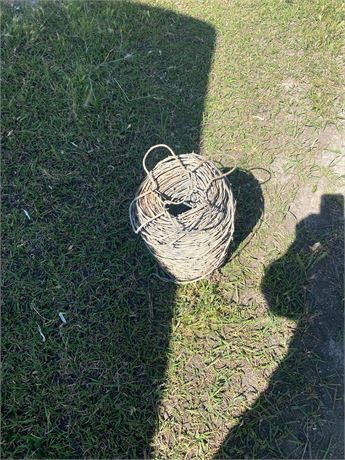 PARTIAL ROLL OF BARB WIRE