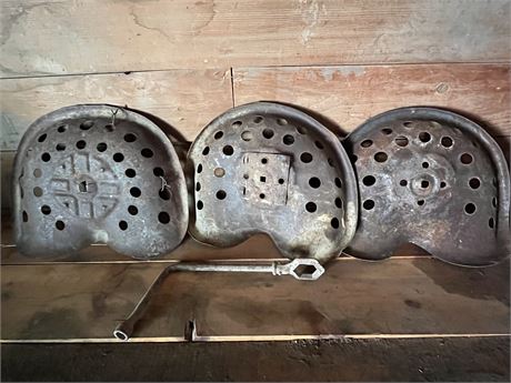 3 Vintage Metal Tracter Seats and an Old Wrench