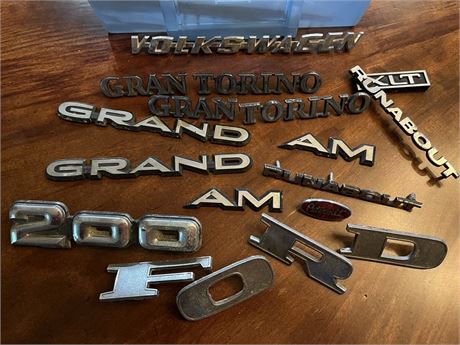 Selection of Mostly Metal Vehicle Name/Model Emblems and Trim Pieces
