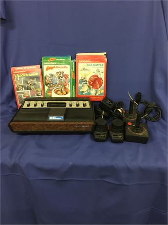 Vintage Atari Console and accessories. T 54