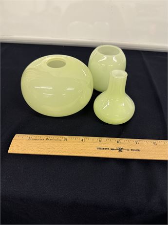 Unique set of green glass dresser vases
