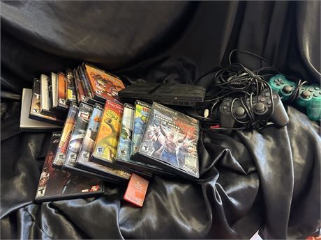 PlayStation 2 Set Up-includes 17 games, 2 controllers, a memory card and wires