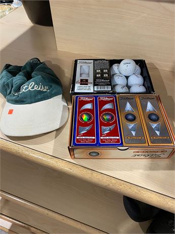 25 Titleist Golf Balls and a Titleist hat