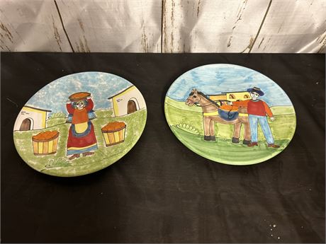 2 Dinner Plates With Paintings Of A Woman And Fruit And A Man With A Donkey.