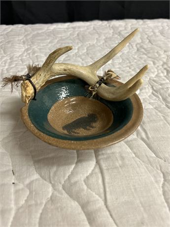 Unique bowl with an antler attached to in and a painting of a buffalo in it 🦬