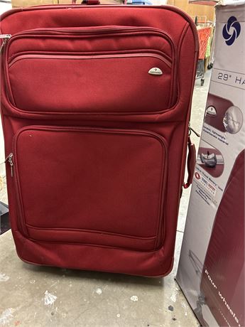 Two really nice Samsonite suitcases one is red one is gray