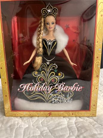 Two Barbie dolls one is a Christmas addition and one is new years addition