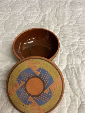 A beautiful small clay pot with lid