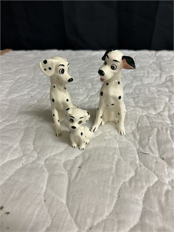 Three figures from 101 Dalmatians