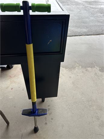 Blue and yellow pogo stick