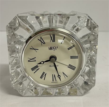 A small clock embedded in glass