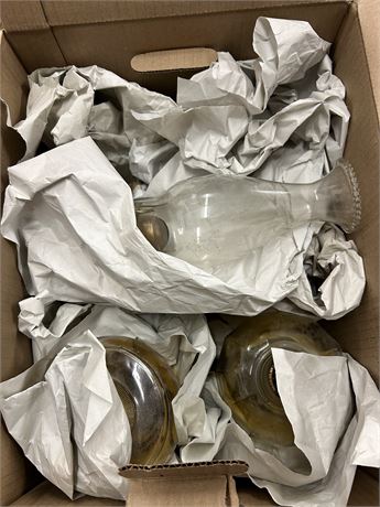 Box full of vintage oil lanterns