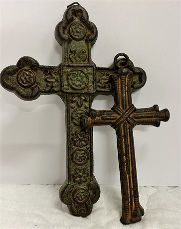 Two vintage cast-iron crosses