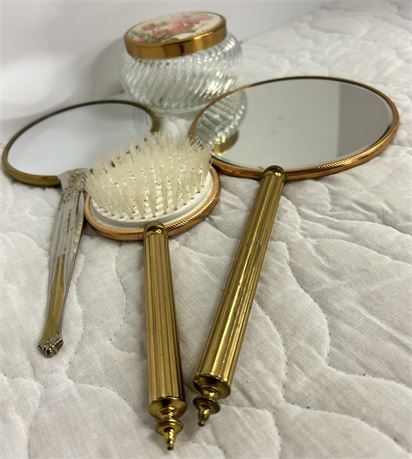 Two Vintage mirrors with vintage comb and a container with flower lid