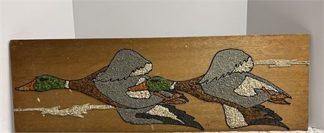 Two ducks flying made out of the beautiful rocks. (36”L x 12”H