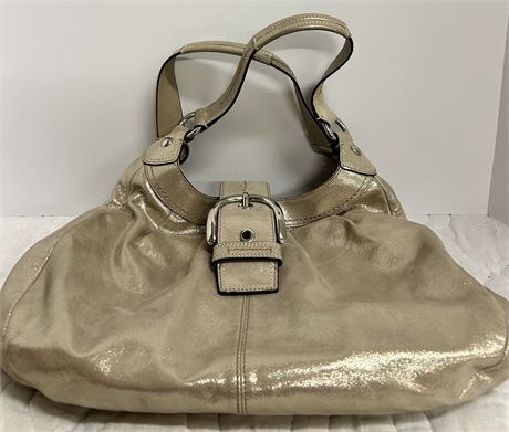 Coach bag handcrafted in China from full grain cowhide leather