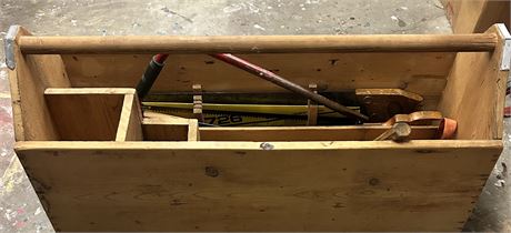 Big Old wooden toolbox with a variety of tools inside