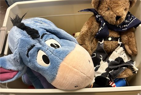 A tote full of children’s toys and some vintage stuffed animals