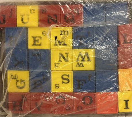 Two boxes of vintage plastic blocks with letters and pictures on them