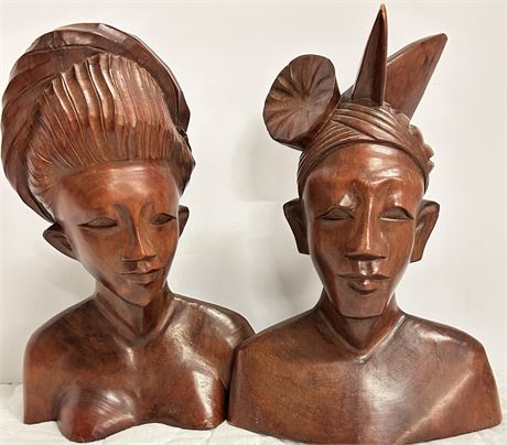 Two beautiful wooden statues of a man and a woman