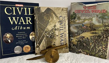 Three books about the Civil War and a small decorative cannon