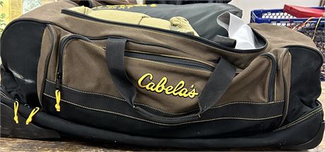 Giant Cabela’s suitcase with camping supplies inside