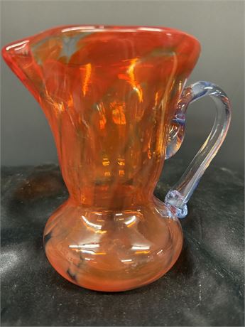 51/2 inch vintage orange glass pitcher