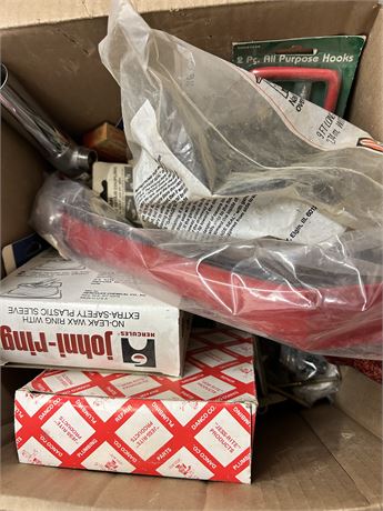 Box of a mix of tools and plumbing parts