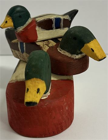 Three wooden ducks