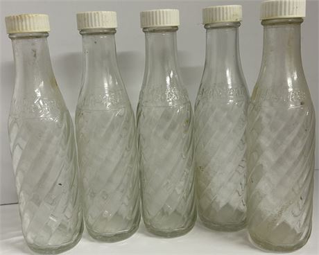 Five glass bottles