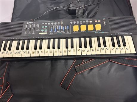 Casio electric keyboard with case