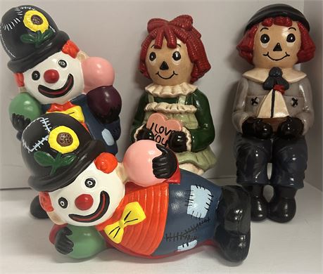 Two ceramic raggedy and an Andy figures and two ceramic hobo clown figures