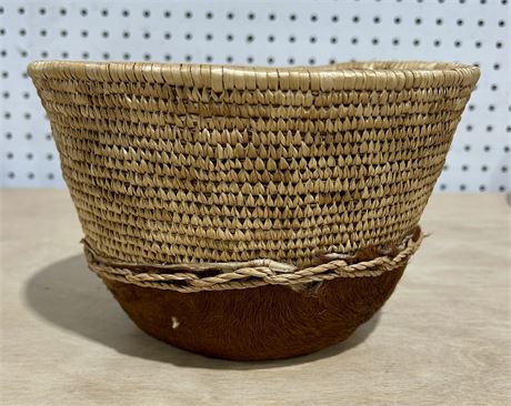 Vintage Hand Woven Basket with Cowhide Base Accent