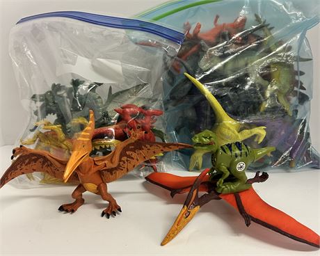 Two gallons size bags full of toy dinosaurs and dragons