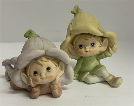 Two ceramic flower elves